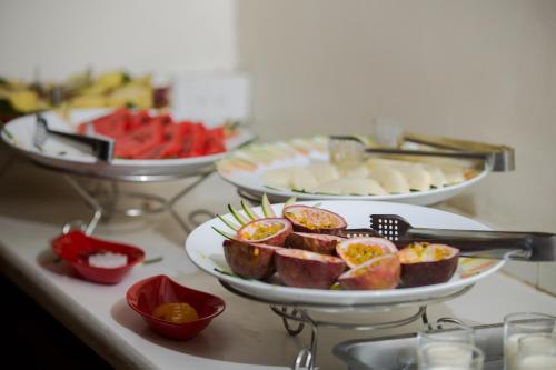 a buffet with several plates of food on a table at Classic Street Hotel in Hanoi