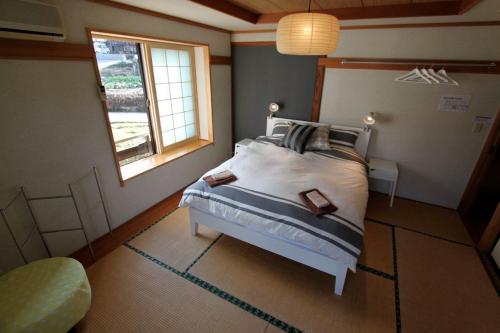Nozawa Central tesisinde bir odada yatak veya yataklar