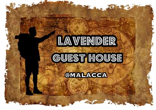 a man pointing at a wall with the words lavender guest house at Lavender@Guesthouse in Melaka