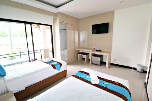 Voodi või voodid majutusasutuse P' Private Resort Cha Am toas