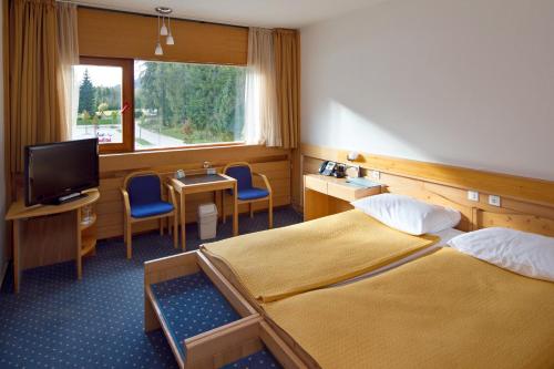Postel nebo postele na pokoji v ubytování Hotel Špik