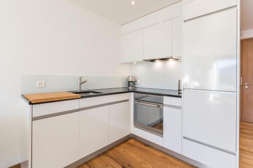 Kuchyň nebo kuchyňský kout v ubytování LAAX Homes - Taviarna Laax 4,5