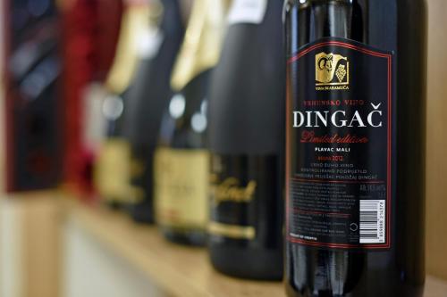 a bottle of wine is sitting on a shelf at Hotel Orient Zagreb in Zagreb