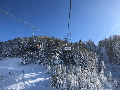 a ski lift going up a snow covered mountain at Brezovica Luxury Villa, Brezovicë in Brezovicë
