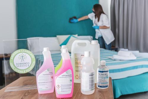 a group of bottles on a table in a hospital room at SorrentoVibes - Luxury Four Bedroom Home with Amazing Terraces in Sorrento in Sorrento