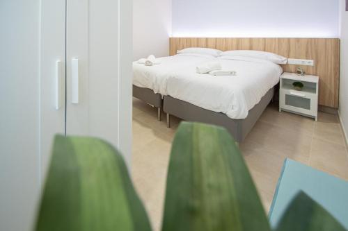 Postel nebo postele na pokoji v ubytování Jardines de Candelaria Cadiz
