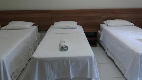 Una cama o camas en una habitación de Pousada Lagoa Seca