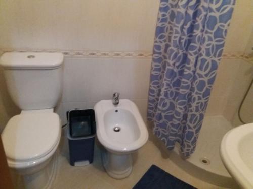 a small bathroom with a toilet and a sink at CHEAP AND COMFORTABLE APARTMENT AT SEASIDE in Vlorë