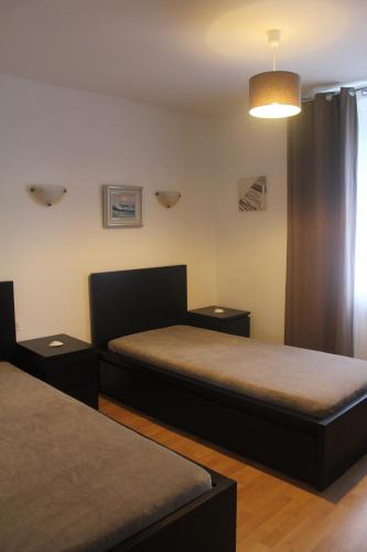 Ένα ή περισσότερα κρεβάτια σε δωμάτιο στο Residence Beau Rivage Brehec