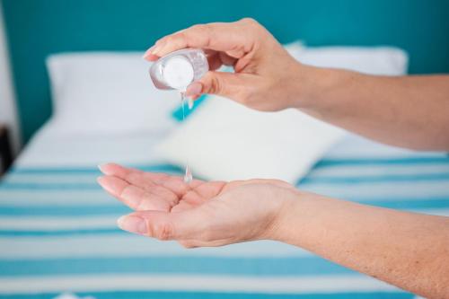 a person holding a needle in their hand at SorrentoVibes - Luxury Design Home & Jacuzzi in Heart of Sorrento in Sorrento