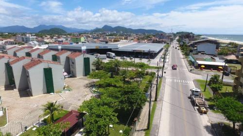 an aerial view of a city with a street and a road at Brejatuba Residence! Conforto e lazer em excelente condomínio in Guaratuba