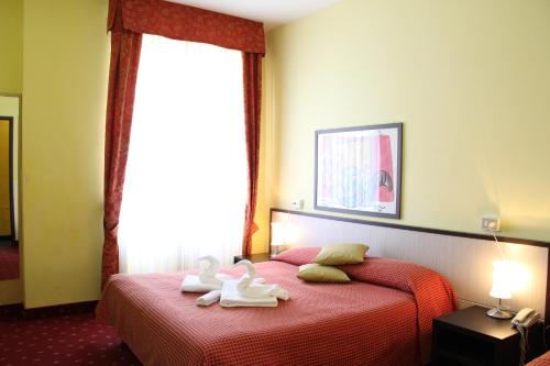 Katil atau katil-katil dalam bilik di Hotel Lugano