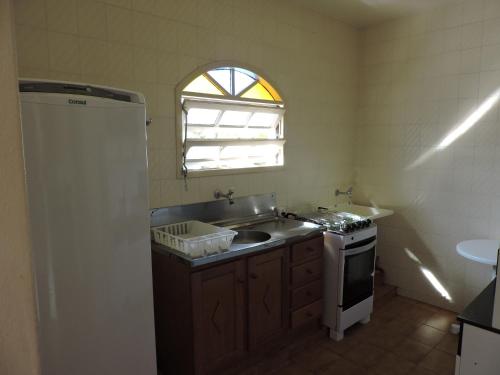 Dapur atau dapur kecil di Residencial Sombreiro