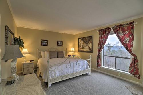 a bedroom with a white bed and a window at 4 Mi to Lake Unit with Pool Access in Fairfield Bay in Fairfield Bay