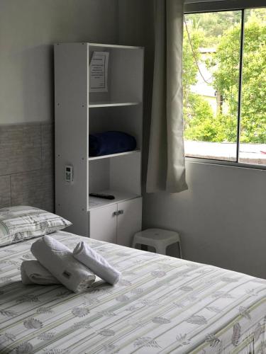 En eller flere senge i et værelse på Apartamentos Neia