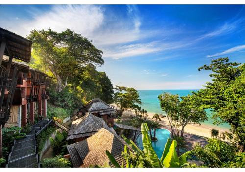 a view of the beach from a resort at Nirvana Beach Resort, Koh Lanta SHA Extra Plus in Ko Lanta