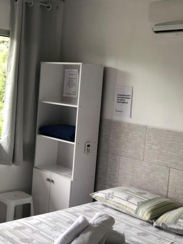 En eller flere senge i et værelse på Apartamentos Neia
