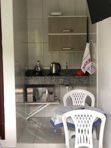 A kitchen or kitchenette at Apartamentos Neia