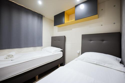 Postel nebo postele na pokoji v ubytování Ms Estrada Mobile Homes