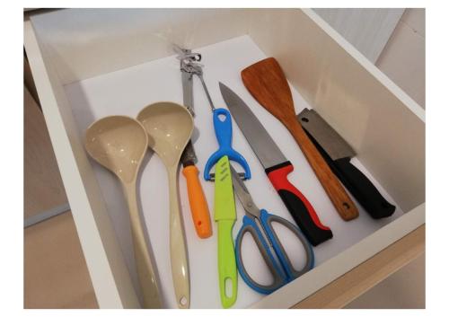 a drawer with four different colored spoons in it at Subang City Residence, 8-9 pax with Balcony, Walking Distance to Summit, 5min to Sunway in Subang Jaya