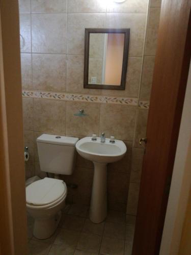 a bathroom with a toilet and a sink at Tini in Neuquén