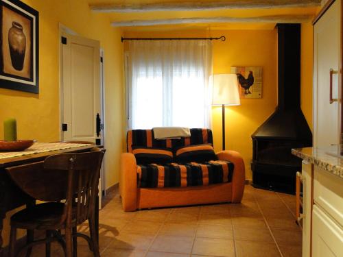 a living room with a couch and a table at Cal Josep in Portell