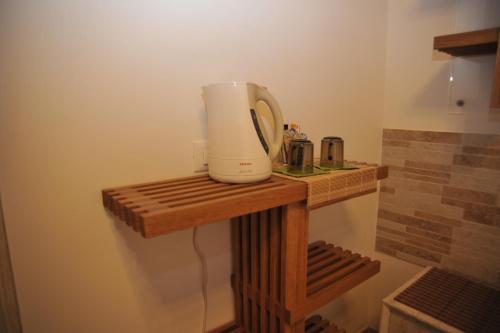 a wooden table with a blender on top of it at 3C B&B in Venice