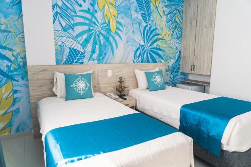 Postel nebo postele na pokoji v ubytování Sea Colors Hotel