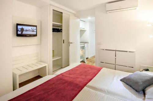 מיטה או מיטות בחדר ב-Hotel Morlans