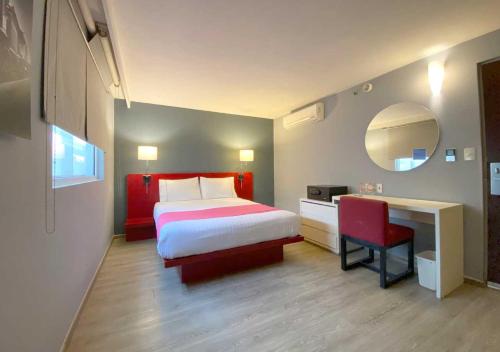 מיטה או מיטות בחדר ב-Hotel MX forum buenavista