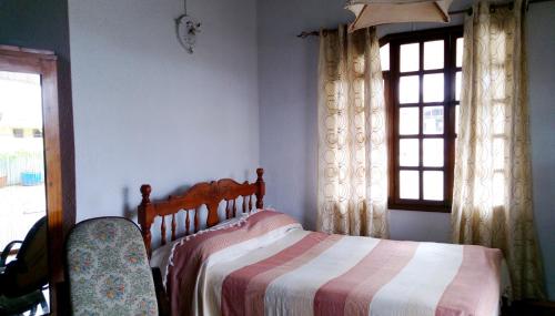 a bedroom with a bed and a window at Charming studio with sea-view terrace in Souillac - 22 m². in Souillac