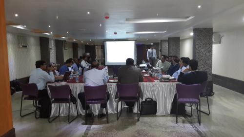 a group of people sitting at tables in a room at Hotel Eastern Plaza in Kolkata