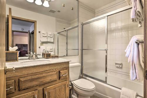 a bathroom with a shower and a toilet and a sink at Ski-InandSki-Out Beaver Creek Condo with Mtn Views! in Beaver Creek