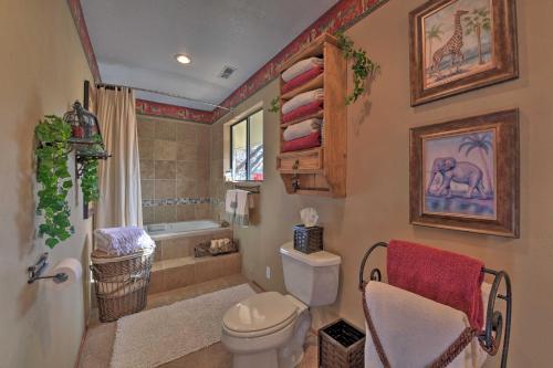 a bathroom with a toilet and a shower and a sink at Mountainside Cabin with Deck - 16 Miles to Skiing! in Lake Arrowhead