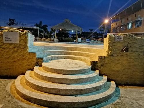 a set of stone stairs in front of a building at Hosteria Mar de Plata in Cabuyal