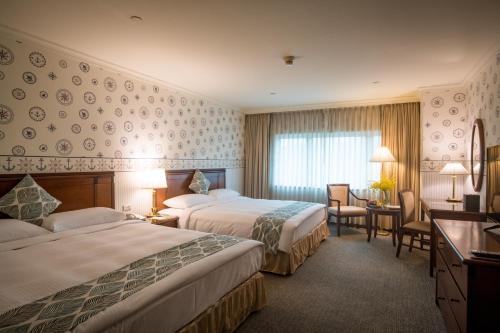 Ліжко або ліжка в номері Evergreen Laurel Hotel - Keelung