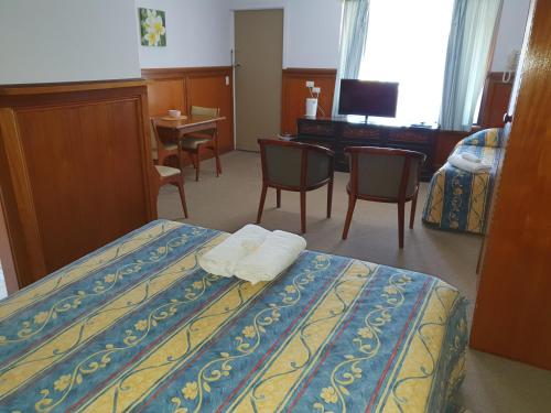 Un ou plusieurs lits dans un hébergement de l'établissement Robe Haven Motel
