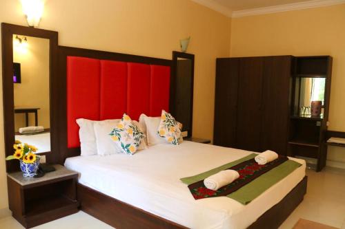 Ліжко або ліжка в номері Riverside Regency Resort