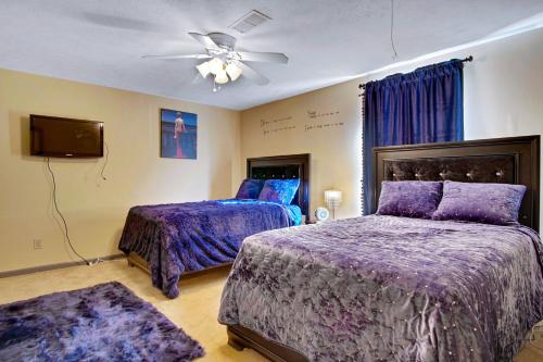 a bedroom with two beds and a ceiling fan at Sweet Home Georgia - Entire 3 bedroom Luxury in Duluth