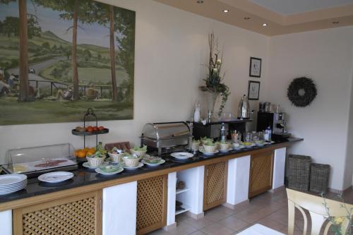 a buffet in a room with food on a counter at Hotel Pit Lane "Home of Motorsport" in Nürburg