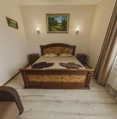 a bedroom with a large bed in a room at Polyana Apart in Polyana