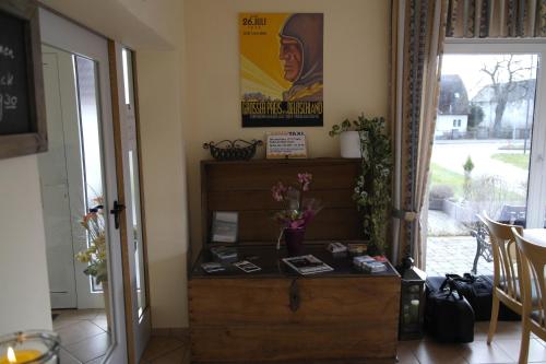 a room with a wooden dresser and a window at Hotel Pit Lane "Home of Motorsport" in Nürburg