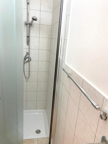 a bathroom with a shower and a toilet at Welcoming Apartment in Realmonte with Sea View - 53 m² in Realmonte