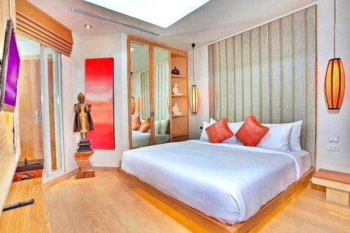 Ένα ή περισσότερα κρεβάτια σε δωμάτιο στο Warm Apartment in Ban Chai Nam, 180 m² with Jacuzzi
