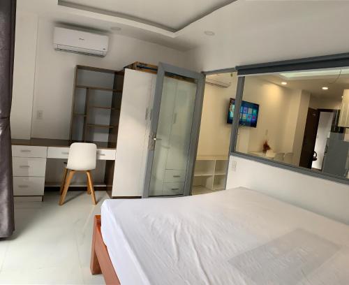 Ένα ή περισσότερα κρεβάτια σε δωμάτιο στο Smiley Apartment Quận 2