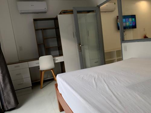 Ένα ή περισσότερα κρεβάτια σε δωμάτιο στο Smiley Apartment Quận 2