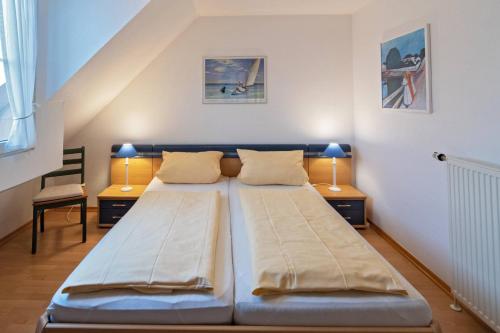 Postel nebo postele na pokoji v ubytování Haus am Siel