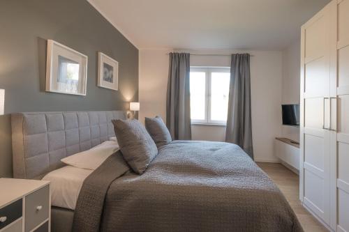 Ένα ή περισσότερα κρεβάτια σε δωμάτιο στο Hafenquartier 54°