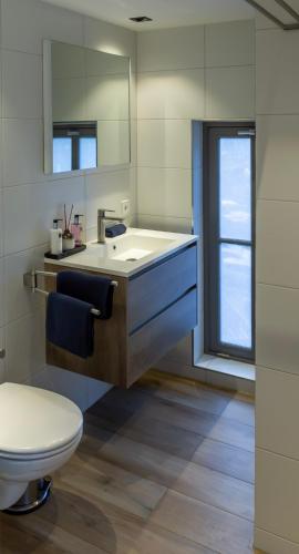 a bathroom with a sink and a toilet at Canal view suite in Amsterdam