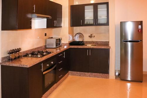 Kuchyň nebo kuchyňský kout v ubytování Apartment Borj Rayhane